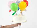 Happy balloon pop kits are sure to make any cake look divine. | 10 Adorable Cake Toppers Part 3 - Tinyme Blog