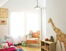 Whimsical playroom with floral giraffe wall decal | 10 Animal inspired Kids Bedrooms - Tinyme Blog