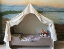 Lovely touches of tent bed and play campfire create a wonderland for your kids | 10 Camp Themed Bedrooms - Tinyme Blog