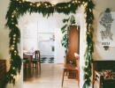 Lighted garland on a doorway | 10 Cute Christmas Garlands - Tinyme Blog