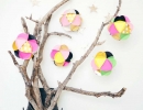 Decorate yourliving room walls with paper ball ornaments | 10 Cute Christmas Ornaments - Tinyme Blog