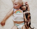 Child and puppy sleeping together | 10 Funny Toddler Moments - Tinyme Blog