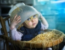 Baby with spaghetti over head | 10 Funny Toddler Moments - Tinyme Blog