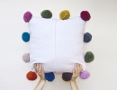 Pom Pom Cushion | 10 Pom Pom Crafts - Tinyme Blog