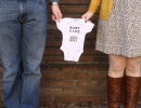 Pregnancy announcement baby onesie | 10 Pregnancy Announcement Photo Ideas - Tinyme Blog