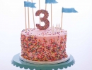 The perfect birthday cake with adorable flags! | 10 Super Sprinkles Cakes - Tinyme Blog