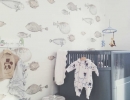 Modern baby room with black crib and fish wallpaper. | 10 Wonderfully Whimsical Nurseries - Tinyme Blog